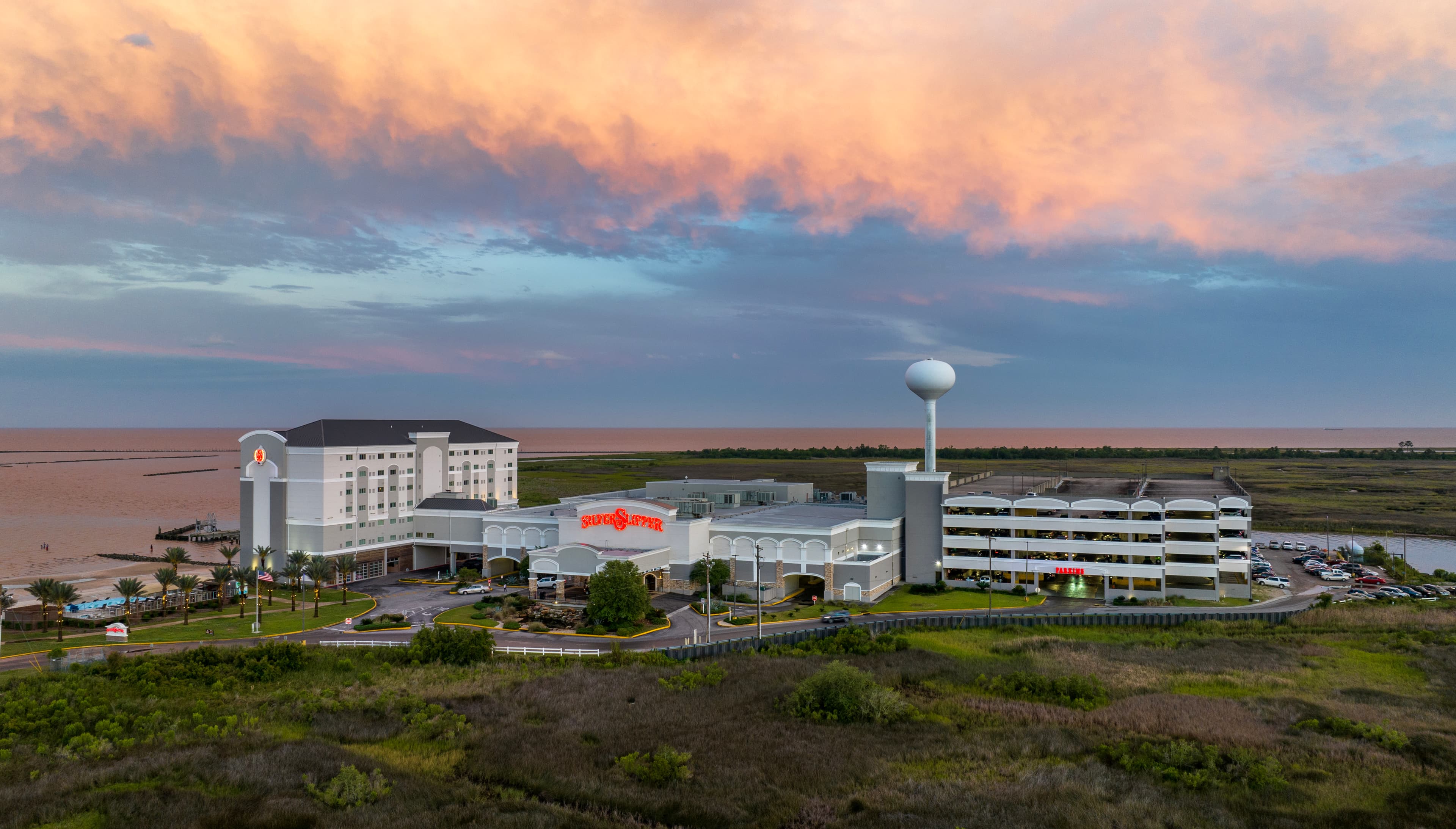 The Silver Slipper Casino at dusk, on the beach next to the park
